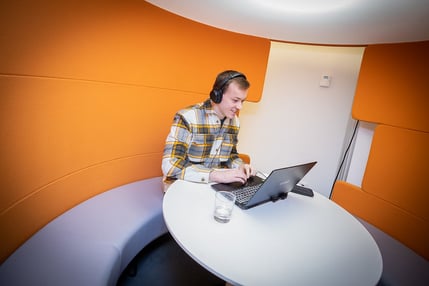 AE consultant working in our orange booth