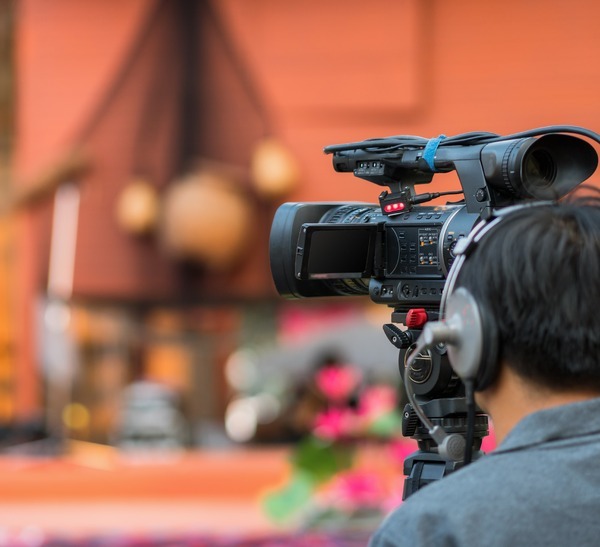 professional-camera-operator-at-work-filming-an-ev-2026-03-10-04-03-32-utc-1