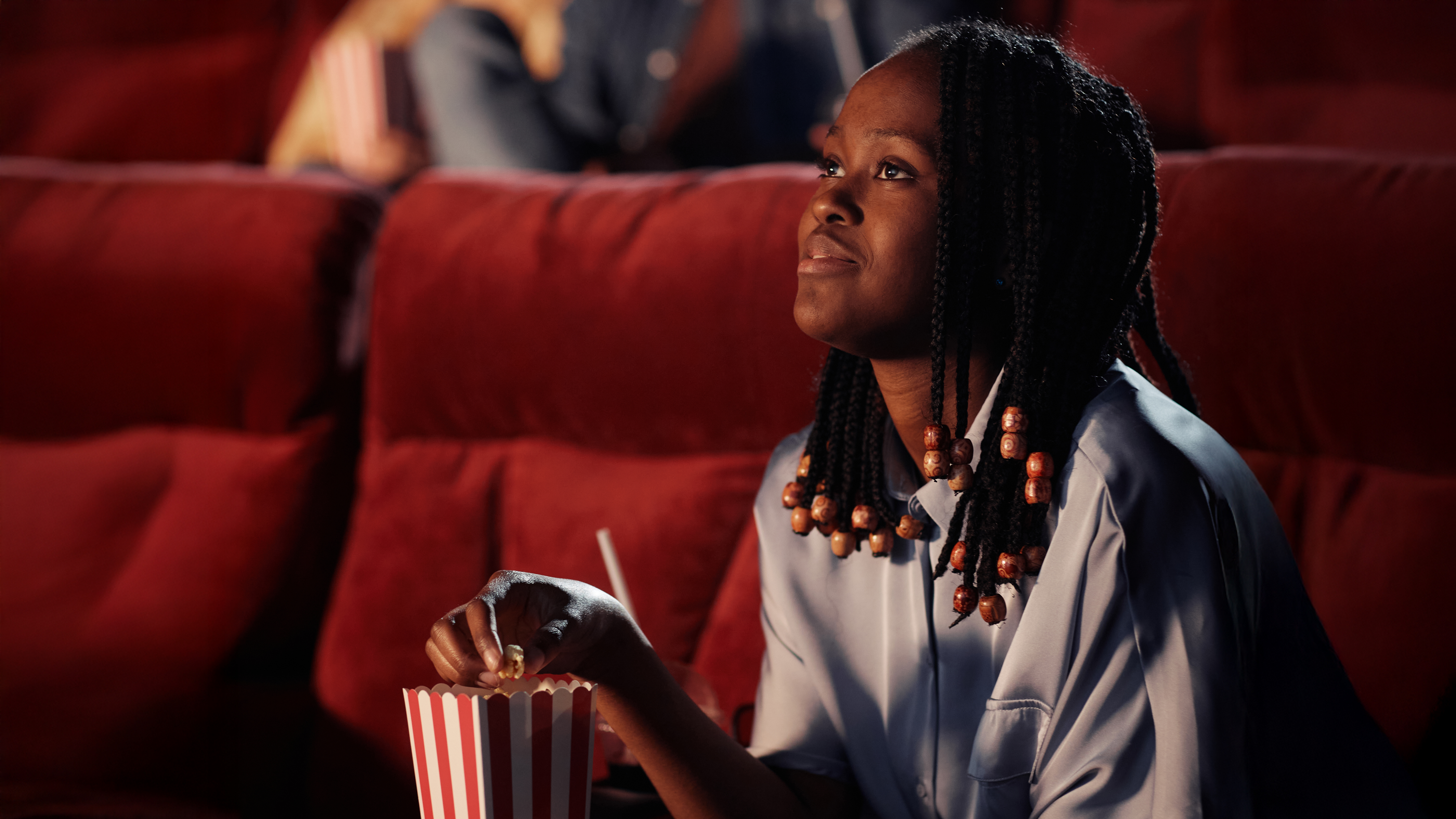 young-woman-watching-a-film-at-the-cinema-2026-09-23-21-22-38-utc copy